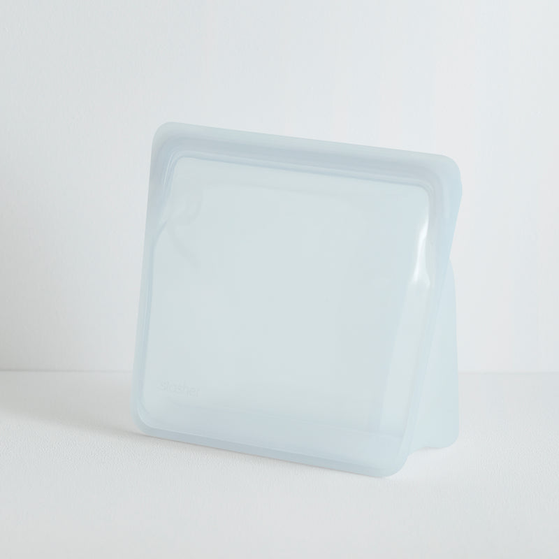 Translucent white Stasher Stand-Up Mega Bag with zip-lock top, made of food-grade platinum silicone